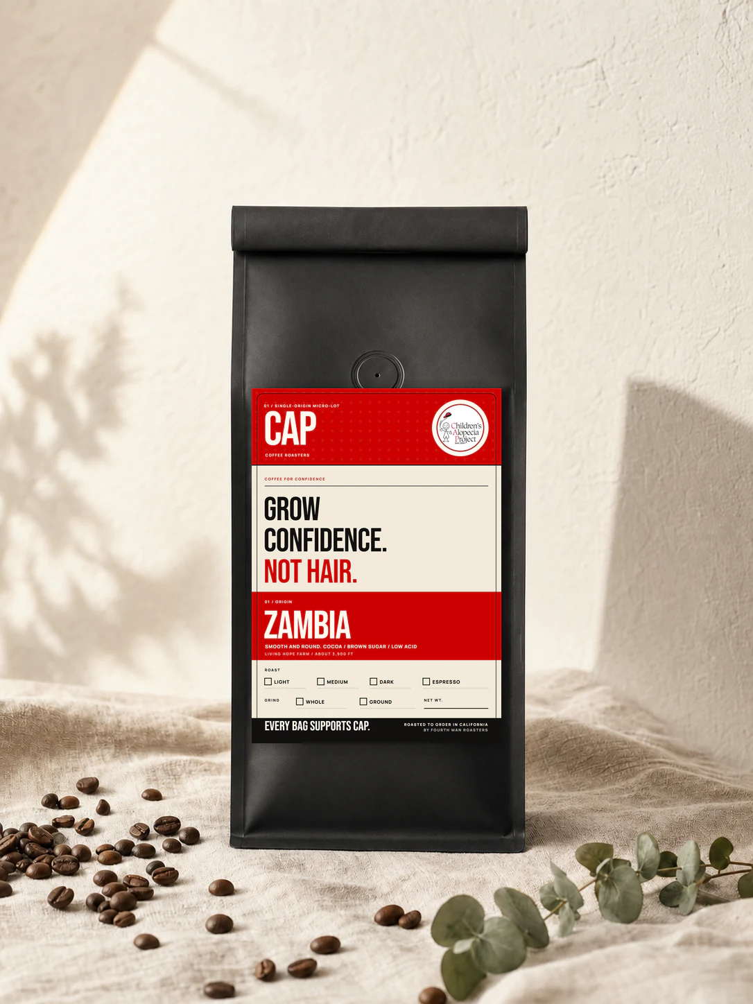 CAP Coffee Roasters Zambia coffee bag with the Grow Confidence, Not Hair label
